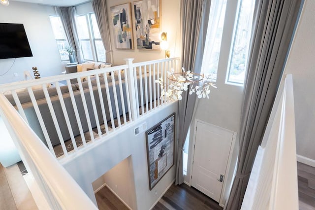 stairs with hardwood / wood-style floors