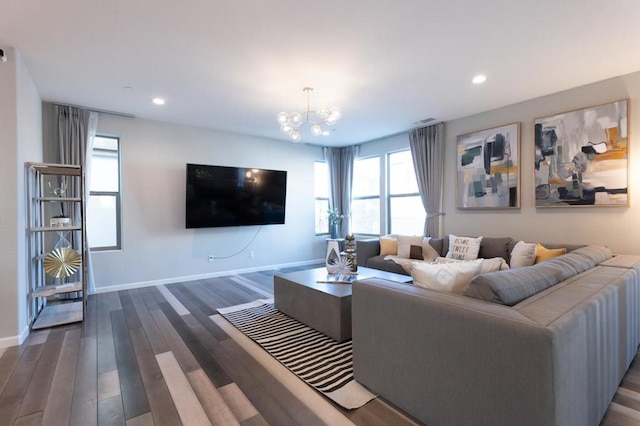 living room featuring dark hardwood / wood-style floors and a notable chandelier