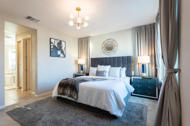 bedroom featuring an inviting chandelier, connected bathroom, and carpet