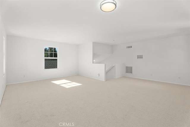 unfurnished room with light colored carpet