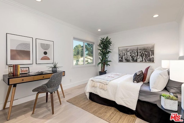 bedroom featuring crown molding and light hardwood / wood-style flooring