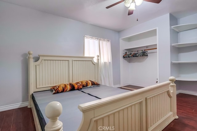 bedroom with ceiling fan, dark hardwood / wood-style flooring, and a closet