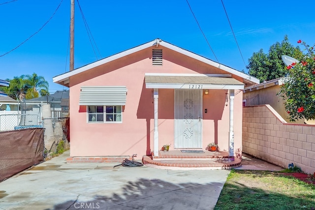 rear view of property featuring a patio