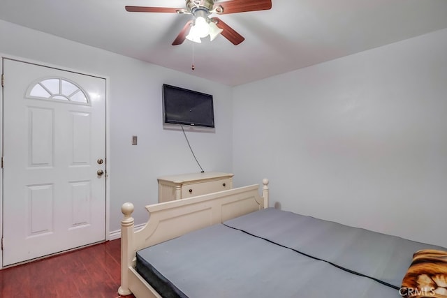 bedroom with ceiling fan and dark wood-type flooring