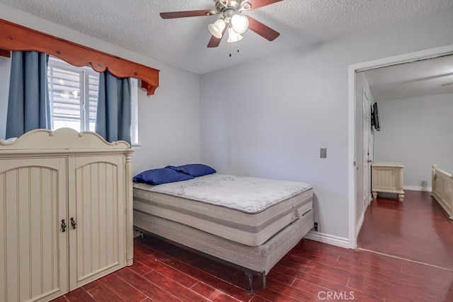 bedroom with a textured ceiling and ceiling fan