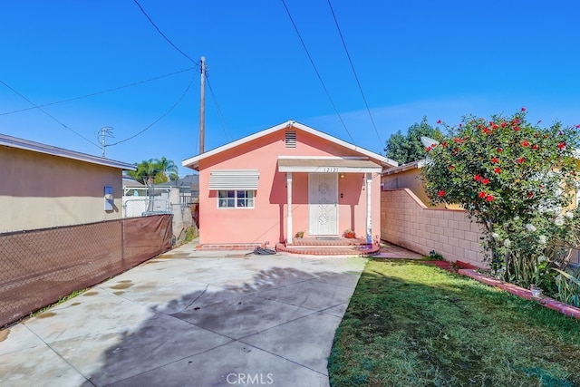 exterior space with a patio area and a front yard