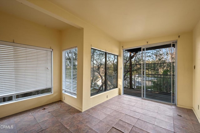 unfurnished sunroom with plenty of natural light