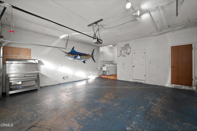 garage featuring a garage door opener and washer and clothes dryer