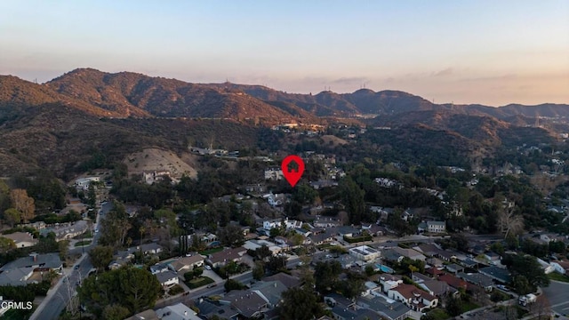 aerial view at dusk with a mountain view