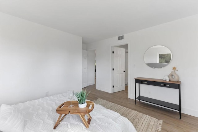 sitting room with hardwood / wood-style flooring