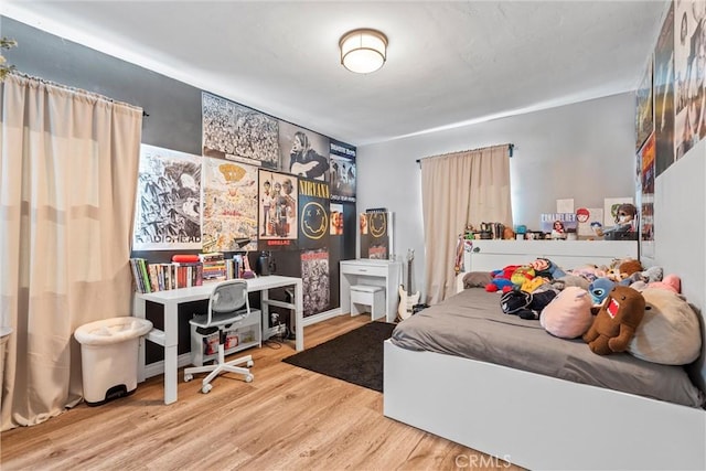 bedroom featuring light wood-type flooring