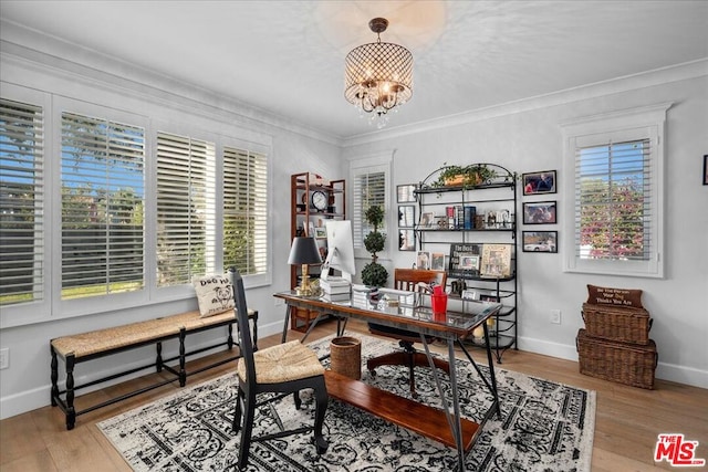 home office featuring ornamental molding, a chandelier, and light wood-type flooring