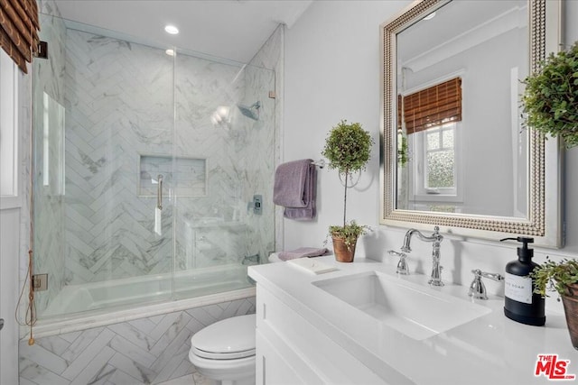 full bathroom featuring combined bath / shower with glass door, toilet, and vanity