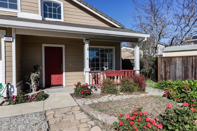 entrance to property featuring a porch