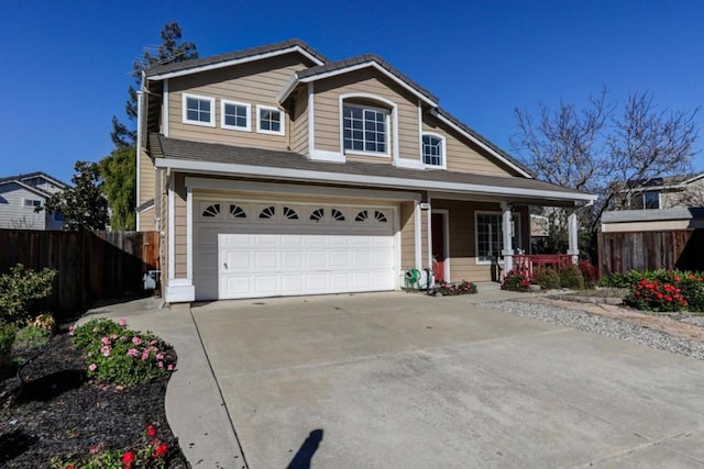 view of front of house with a porch and a garage