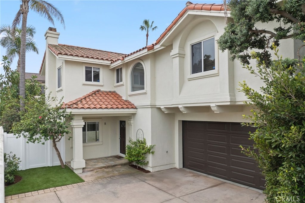 mediterranean / spanish house featuring a garage