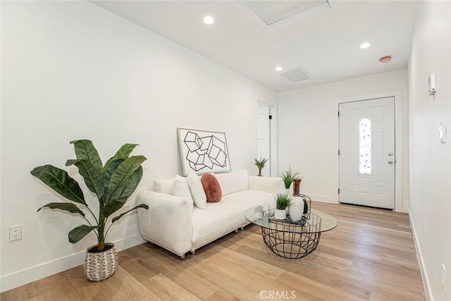 living room with light hardwood / wood-style flooring