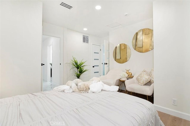 bedroom with light hardwood / wood-style floors