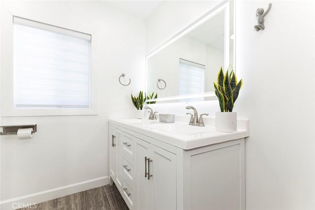 bathroom featuring hardwood / wood-style floors and vanity