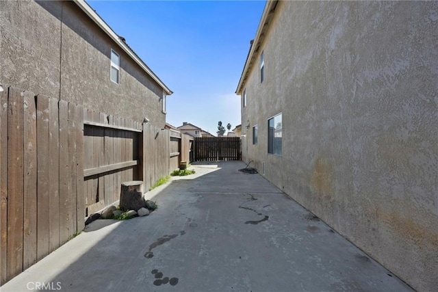 view of side of home featuring a patio