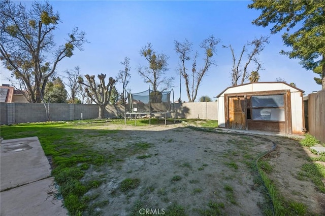 view of yard with a trampoline