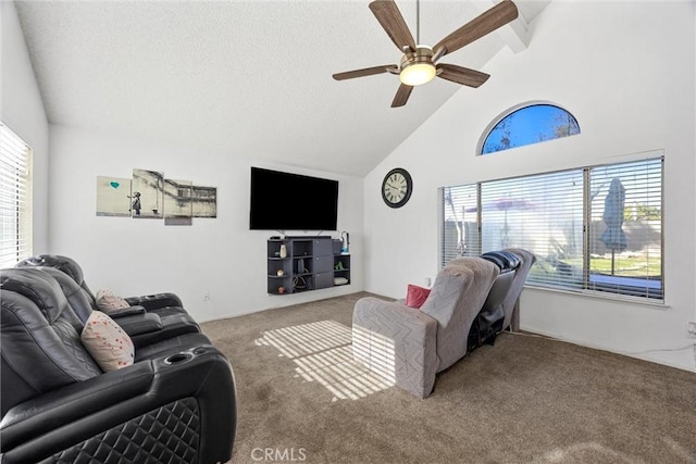 living room with a textured ceiling, carpet floors, high vaulted ceiling, beam ceiling, and ceiling fan