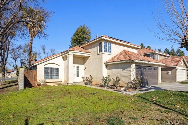 mediterranean / spanish-style house with a garage and a front lawn