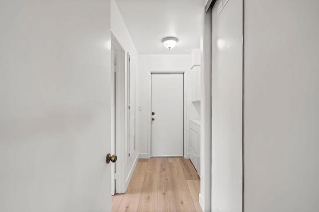 corridor with light wood-type flooring