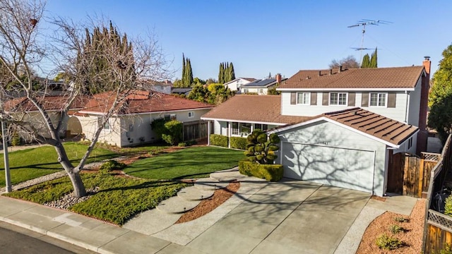 view of front facade featuring a garage and a front lawn