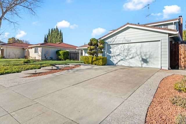 view of front facade featuring a garage and a front yard