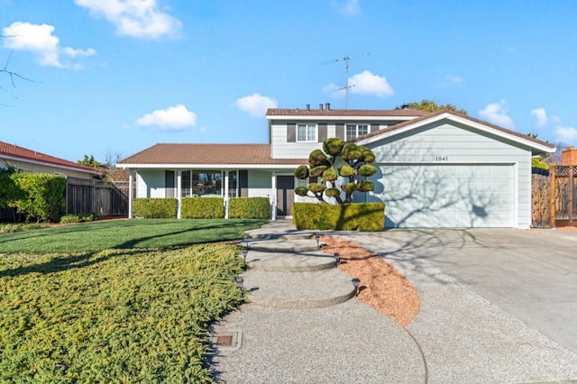 view of front facade featuring a front yard and a garage