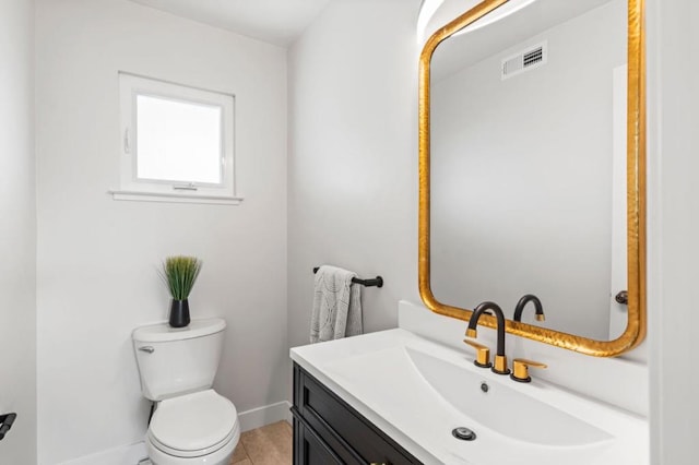 bathroom with tile patterned floors, toilet, and vanity