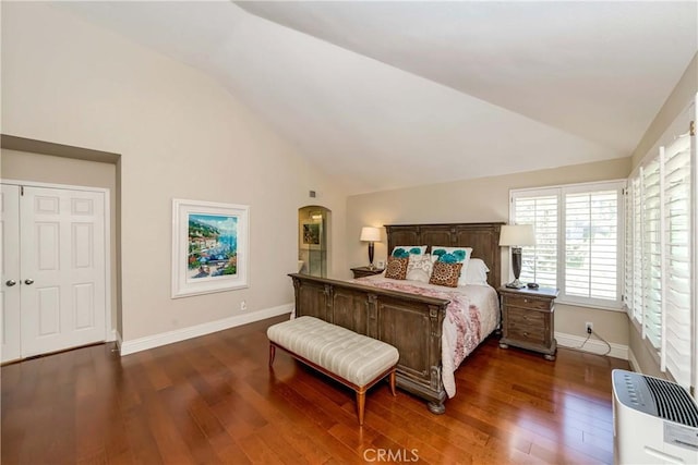 bedroom featuring lofted ceiling and dark hardwood / wood-style flooring