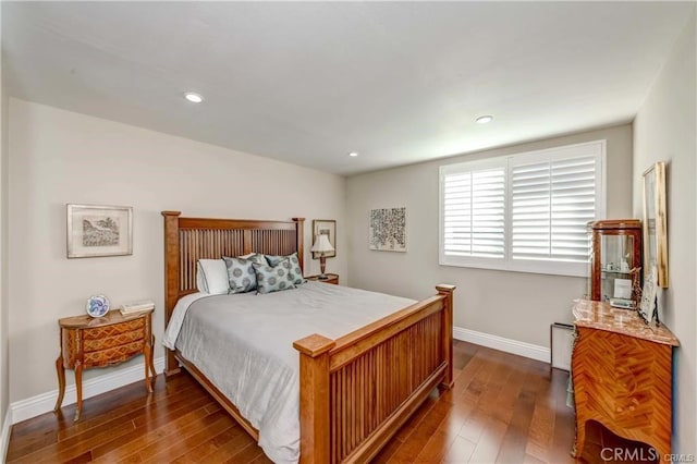 bedroom featuring dark hardwood / wood-style flooring