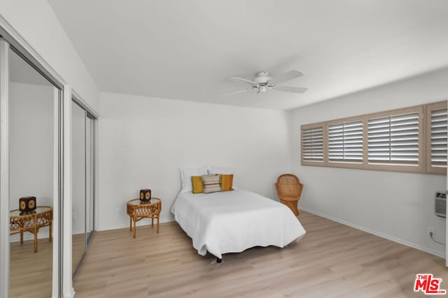 bedroom featuring ceiling fan and light hardwood / wood-style floors