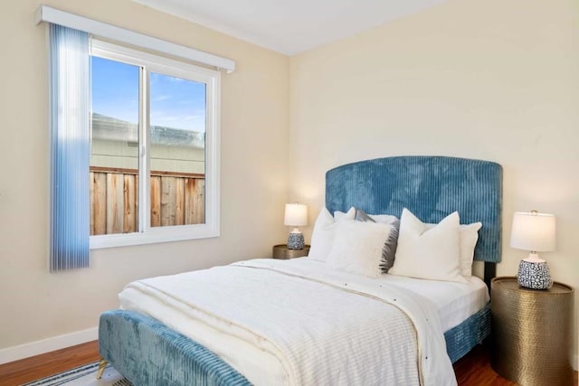 bedroom with hardwood / wood-style flooring