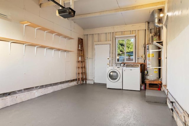 garage featuring a garage door opener, washing machine and dryer, and strapped water heater