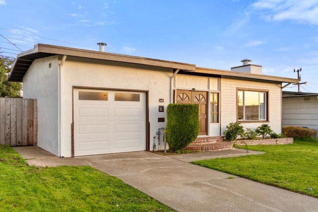 ranch-style house featuring a garage and a front yard