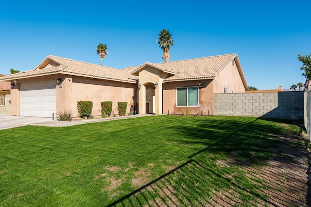 view of front of house with a garage and a front yard