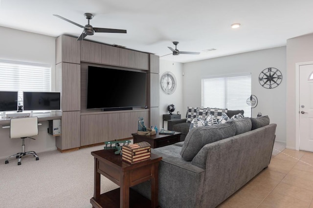 tiled living room with ceiling fan