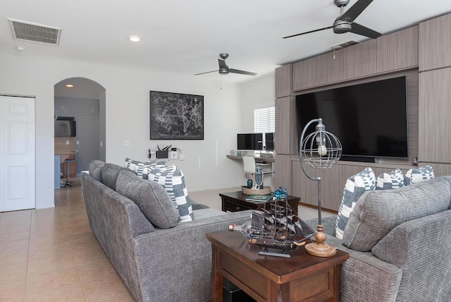 living room featuring ceiling fan and light tile patterned flooring