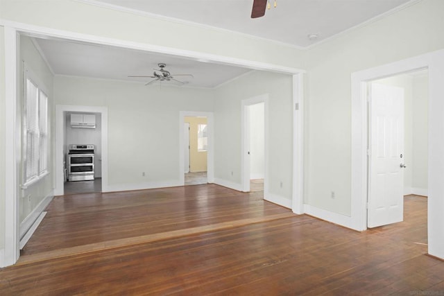 unfurnished living room featuring crown molding, dark hardwood / wood-style floors, and ceiling fan