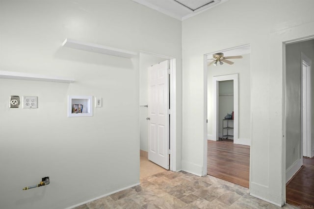 laundry room featuring washer hookup and crown molding