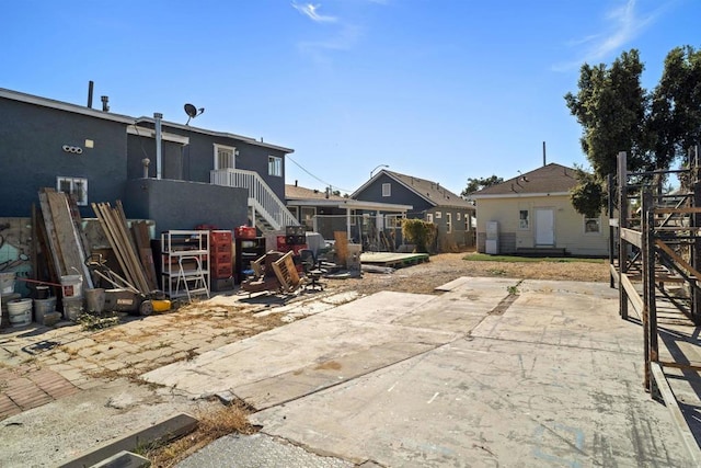 rear view of house featuring a patio