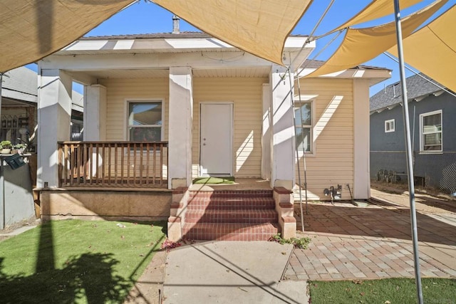 entrance to property with a porch