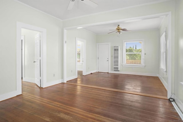 unfurnished living room featuring ceiling fan, dark hardwood / wood-style flooring, and ornamental molding