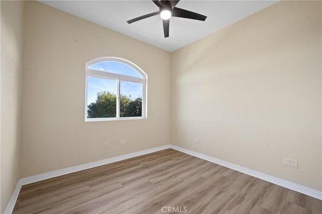 unfurnished room featuring ceiling fan and light wood-type flooring