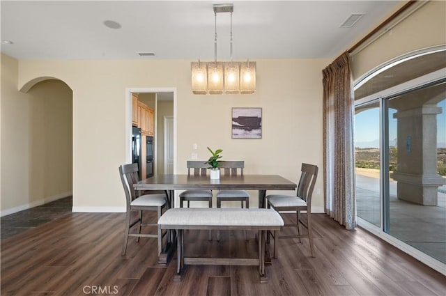 dining room with dark wood-type flooring