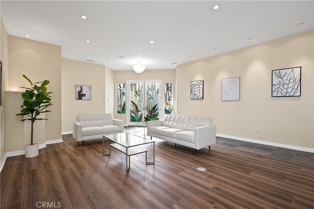 living room with dark hardwood / wood-style flooring