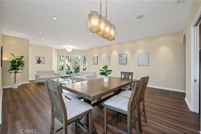 dining space featuring dark hardwood / wood-style flooring